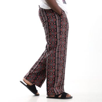 Aztec Nomad cotton baggy trousers in red and black with elastic waist and side pockets.