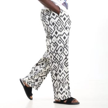 Coastal ikat linen-feel baggy trousers in black and white with elastic waist and side pockets.